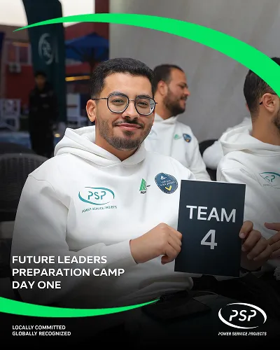 Engineering student holding Team 4 sign during PSP Future Leaders Preparation Camp Day One.